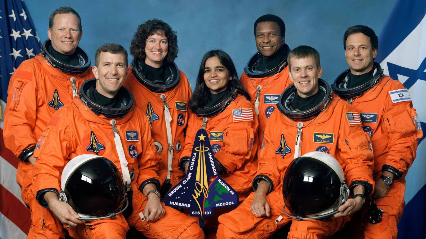 The seven crew members of the Space Shuttle Columbia STS 107 mission posing for a group portrait in orbit.