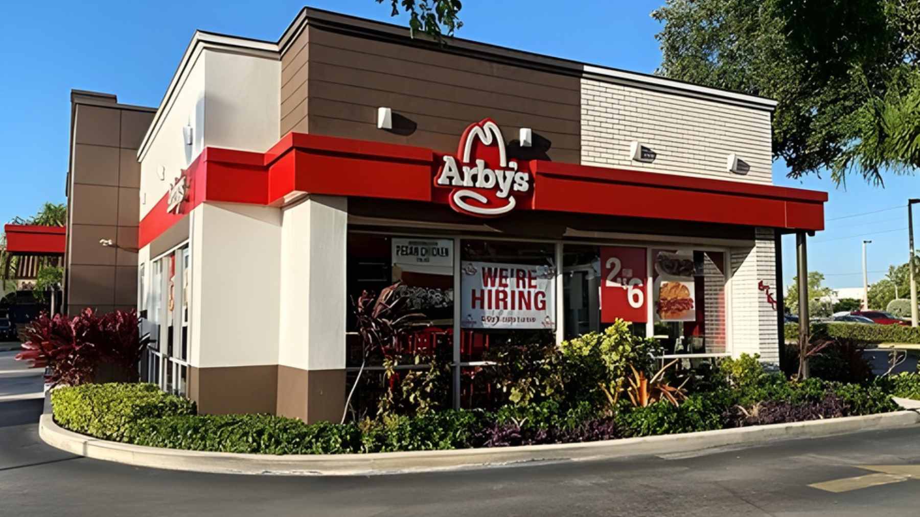 An Arby's restaurant exterior with a "Closed" sign in the window and an empty parking lot in California.