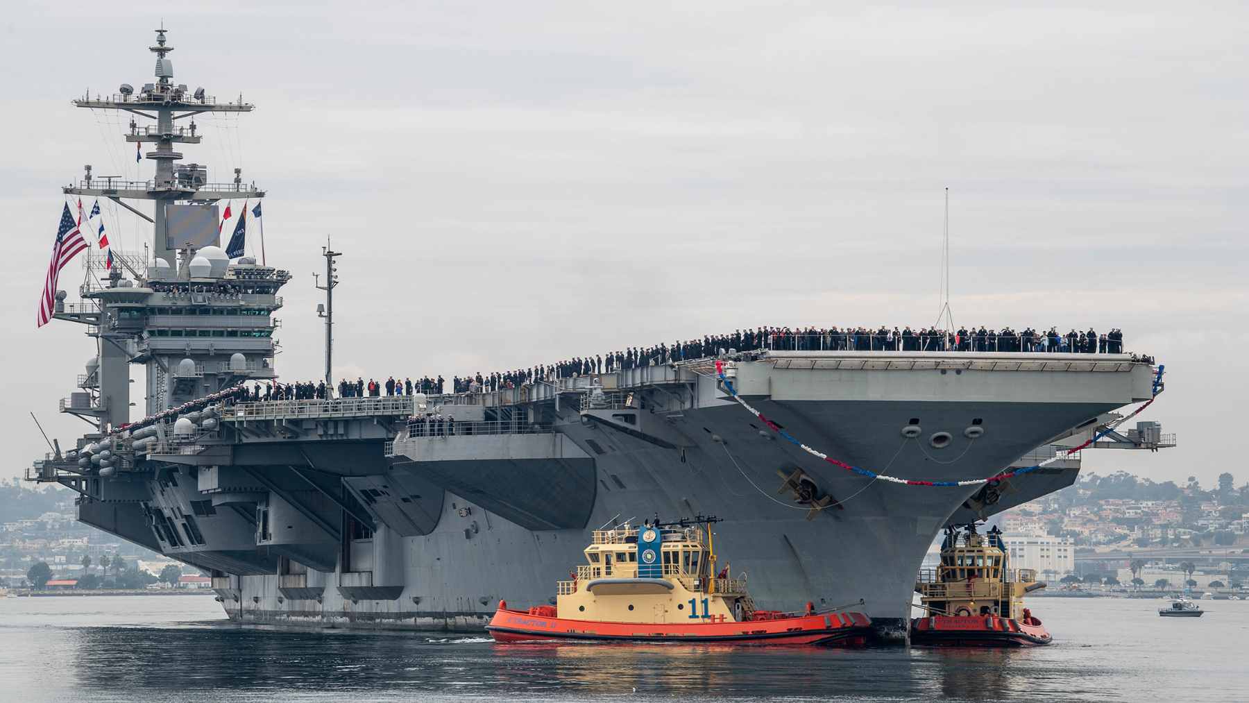 A U.S. Navy F-35C Lightning II stealth fighter jet preparing for takeoff from the flight deck of the USS Abraham Lincoln.