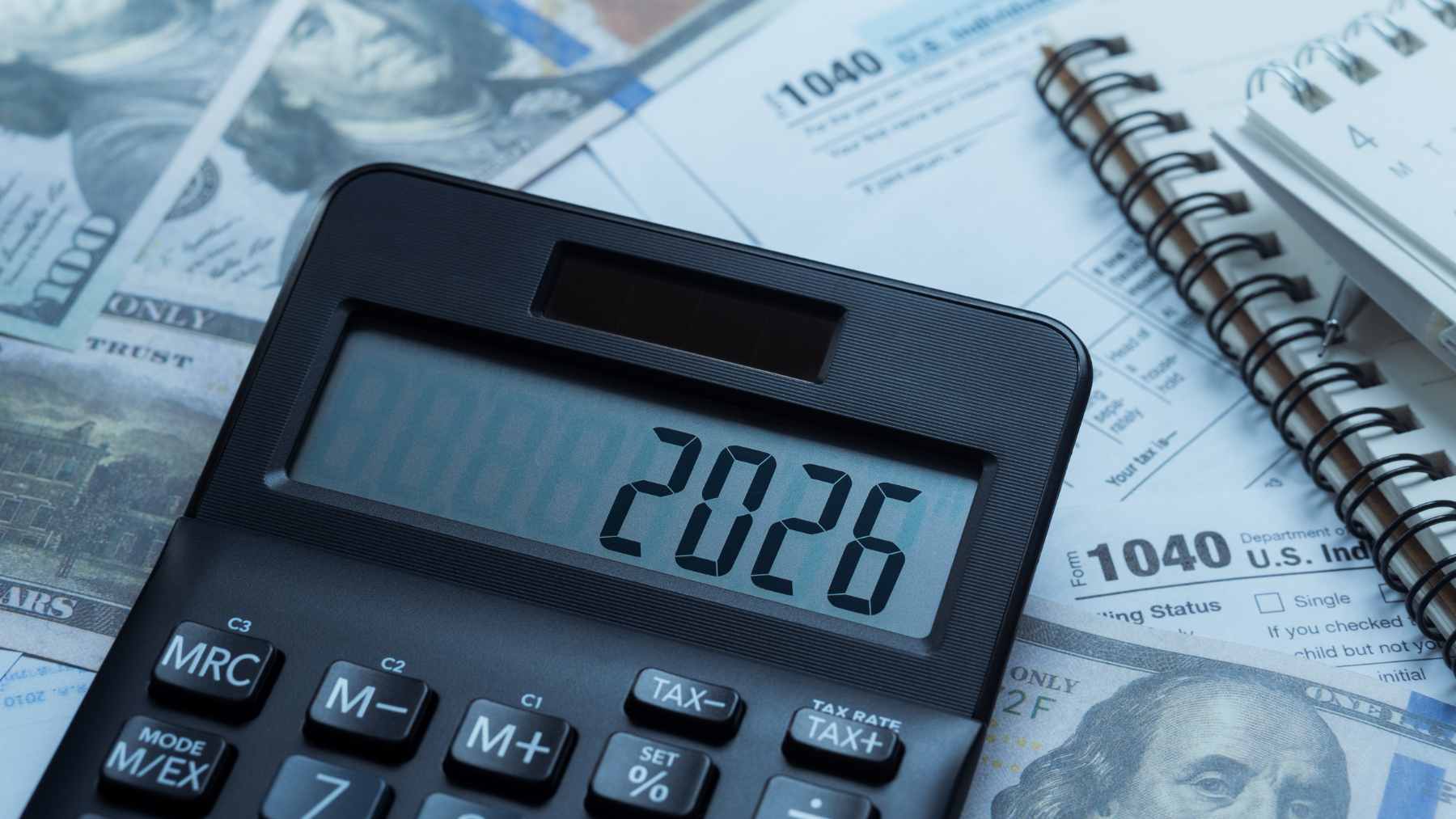 A smartphone displaying a fake stimulus check notification next to an official IRS.gov tax refund status page on a laptop.