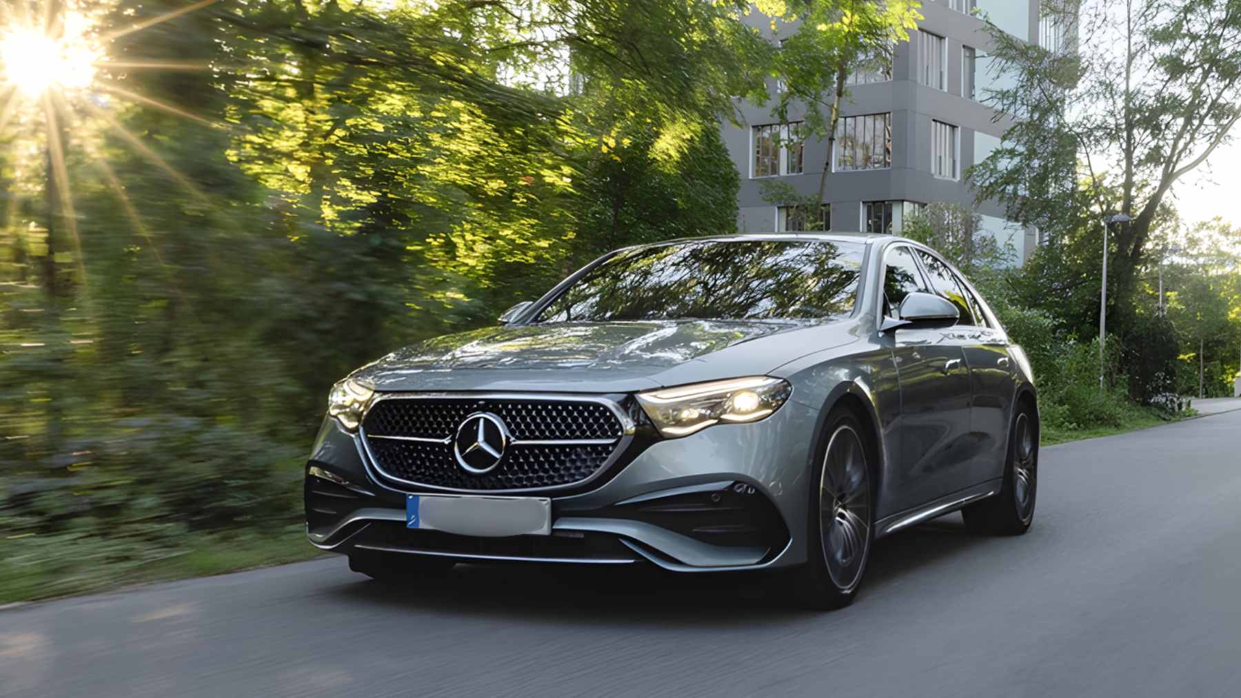 A close-up of the Mercedes-Benz, BMW, and Volkswagen logos representing the German automotive industry.