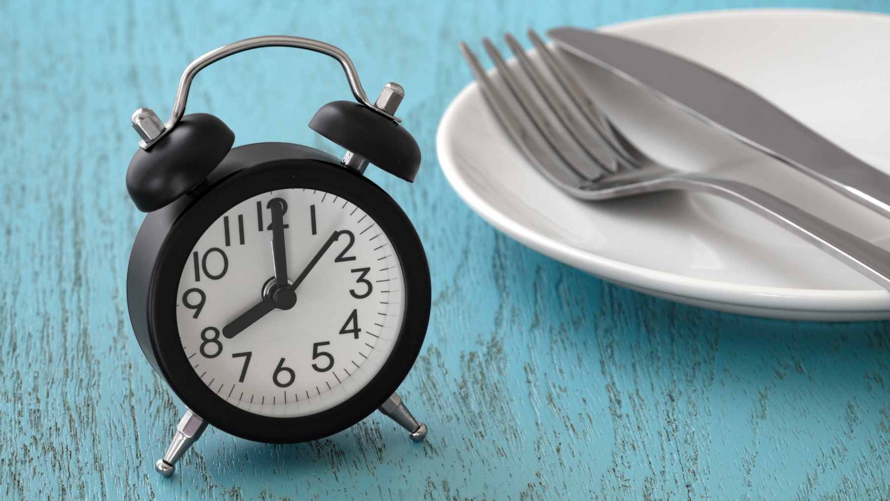 A microscopic 3D visualization of a cell undergoing autophagy, where an autophagosome captures damaged proteins for recycling.