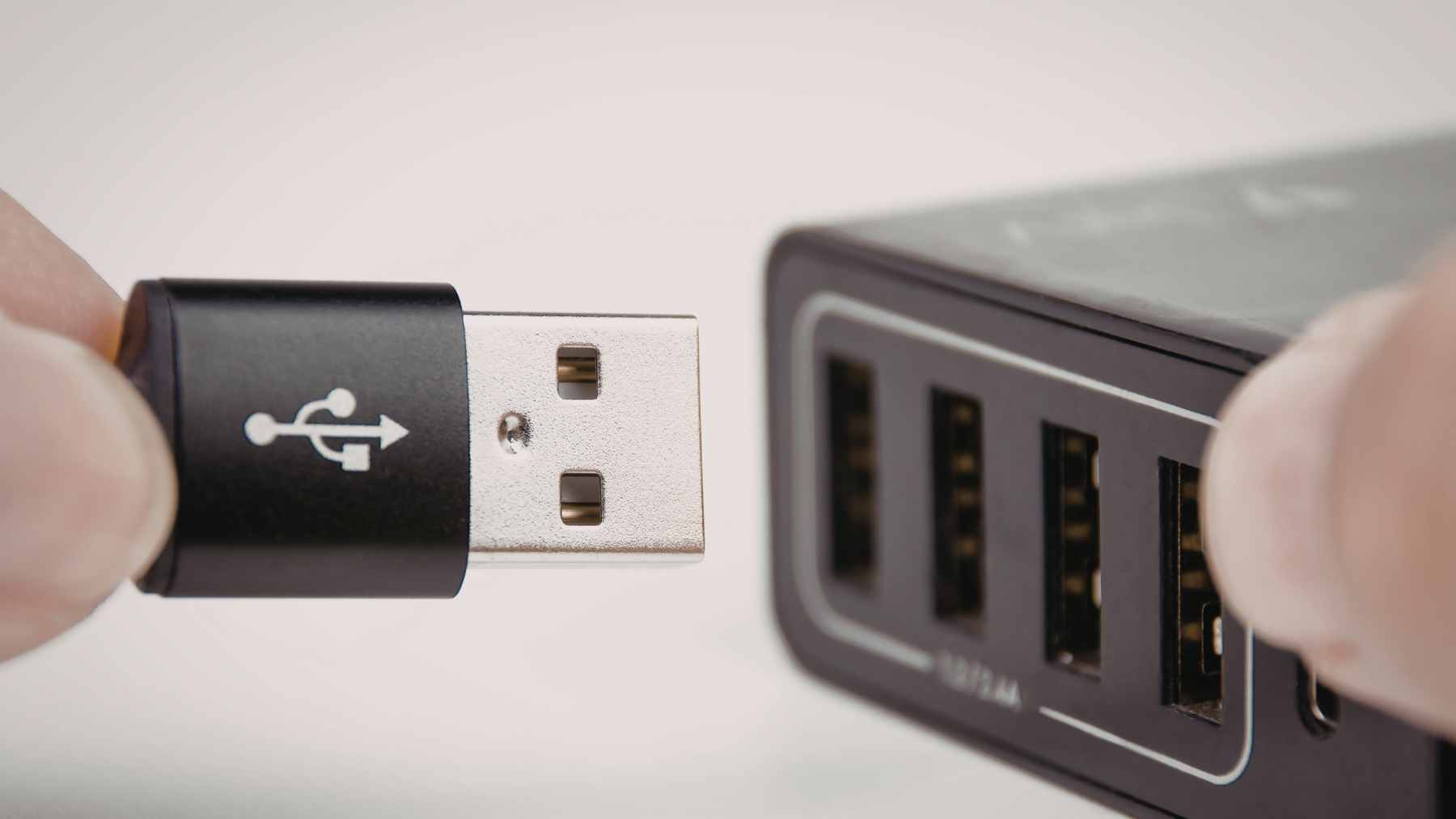 Close-up of a purple USB-A port on a power adapter, indicating support for high-wattage proprietary fast charging.