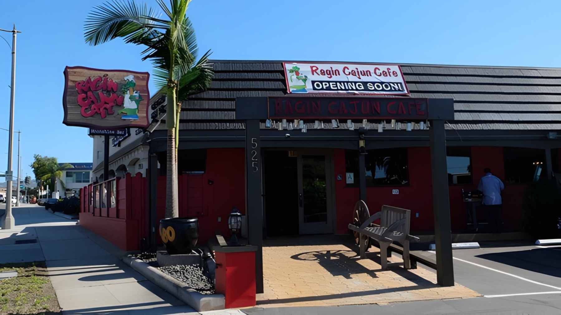 The iconic neon sign and entrance of Ragin Cajun Cafe in Redondo Beach, California.