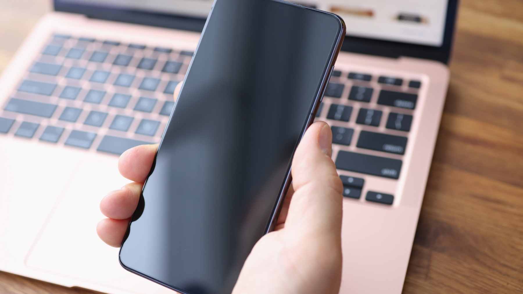 A front and back view of the Samsung Galaxy S20 FE in Cloud Navy, showing the triple camera setup and Infinity-O display.
