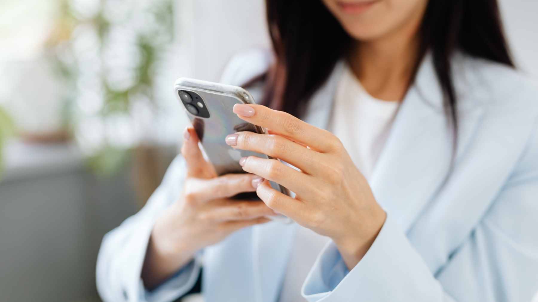 A smartphone screen displaying icons for Shein, Temu, and TikTok with a "prohibited" security stamp overlay.