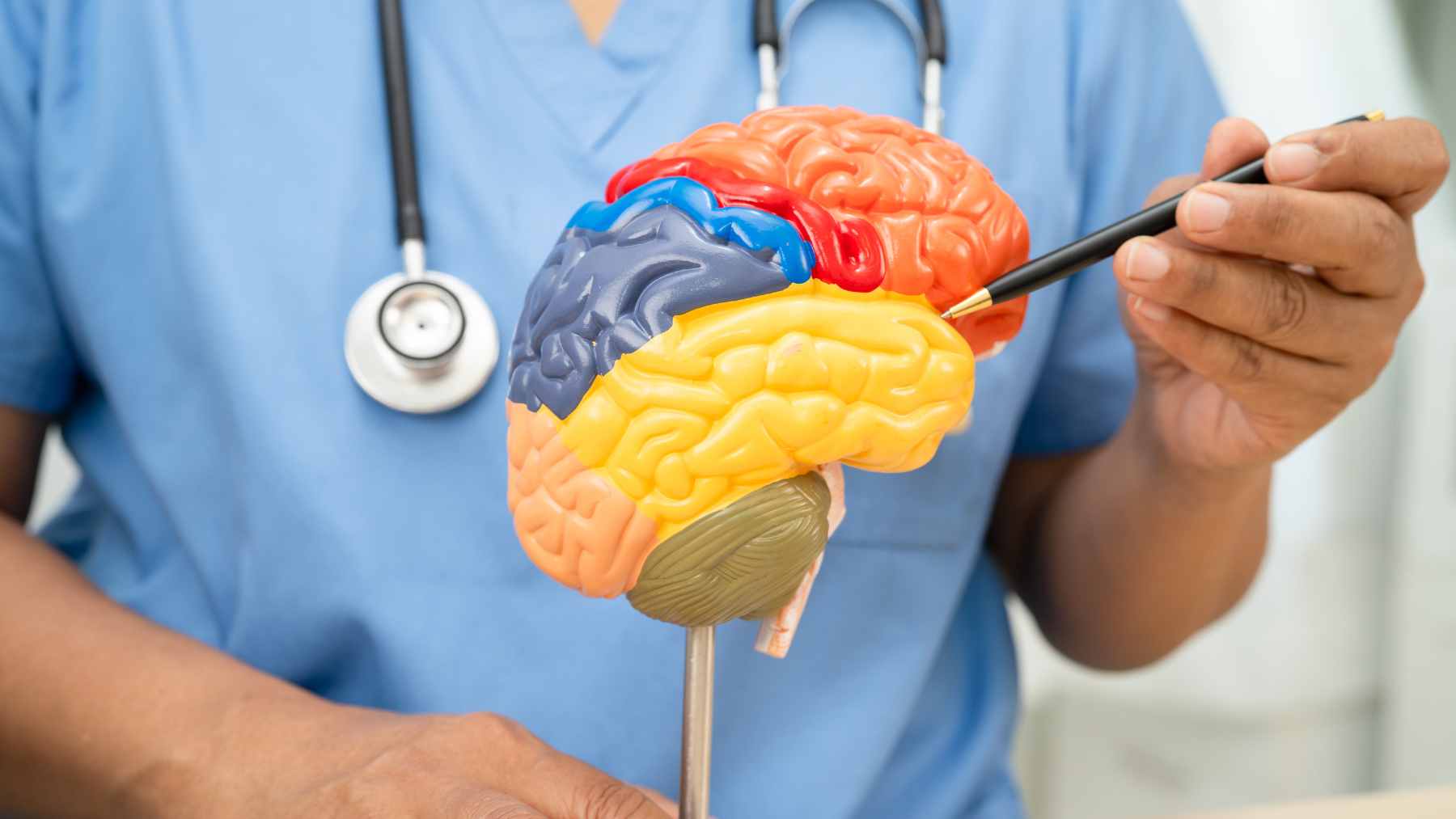 A patient wearing a specialized ultrasound helmet with over a thousand transducers for a non-invasive brain procedure at Ruijin Hospital.