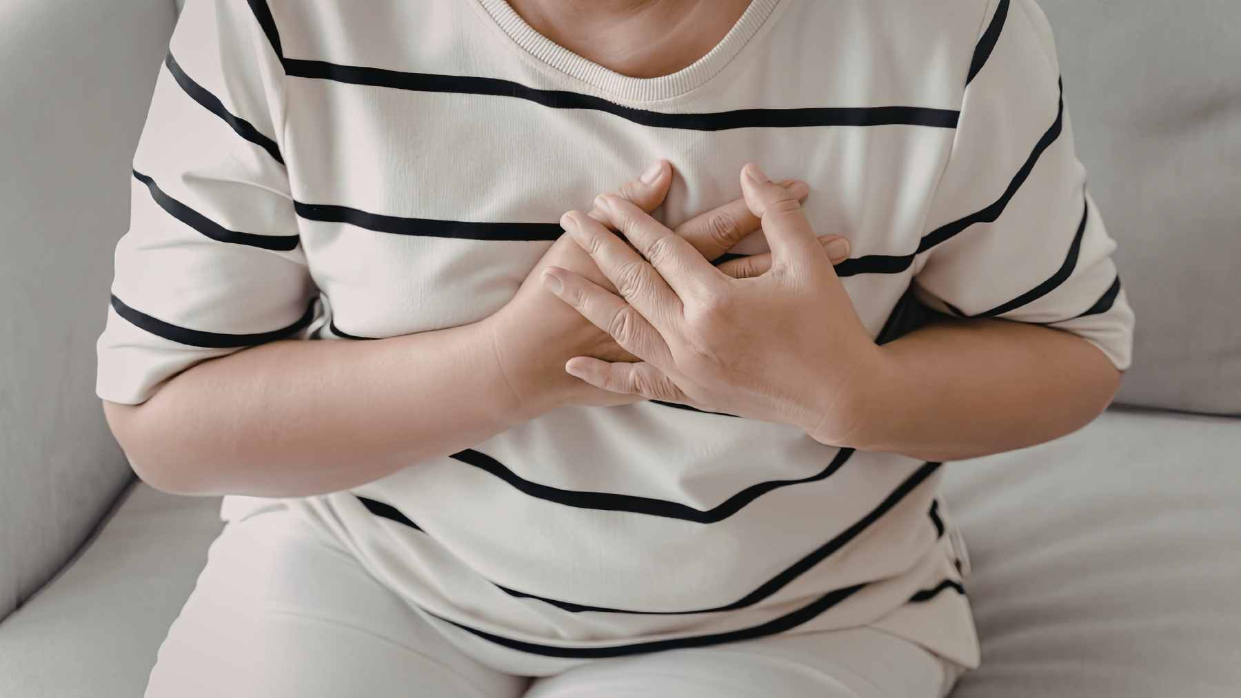 A medical illustration showing a cross-section of a healthy artery compared to one narrowed by fatty plaque buildup.