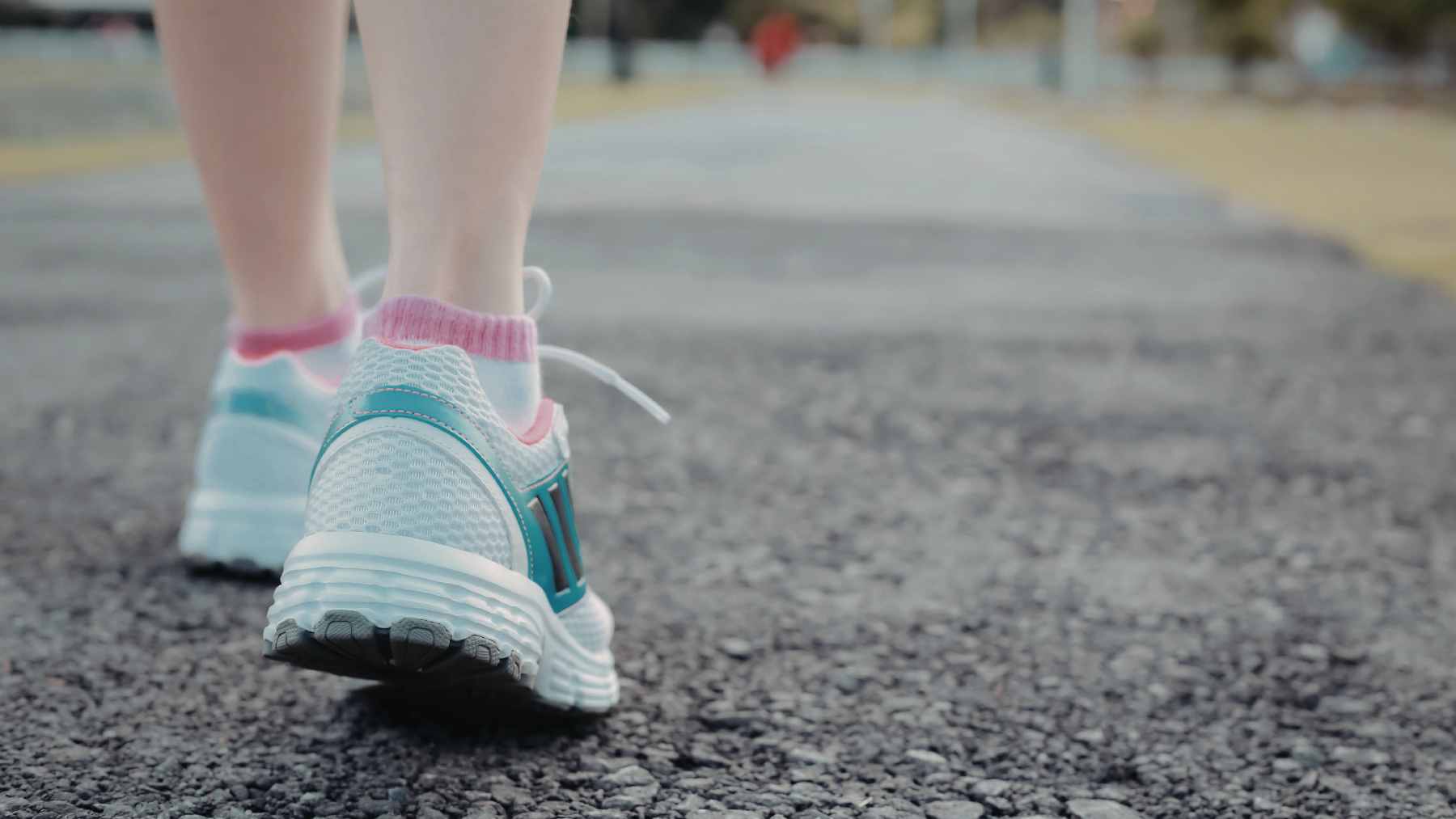A split-screen graphic showing a person walking briskly and a person running up a set of stairs, representing moderate vs. vigorous exercise intensity.