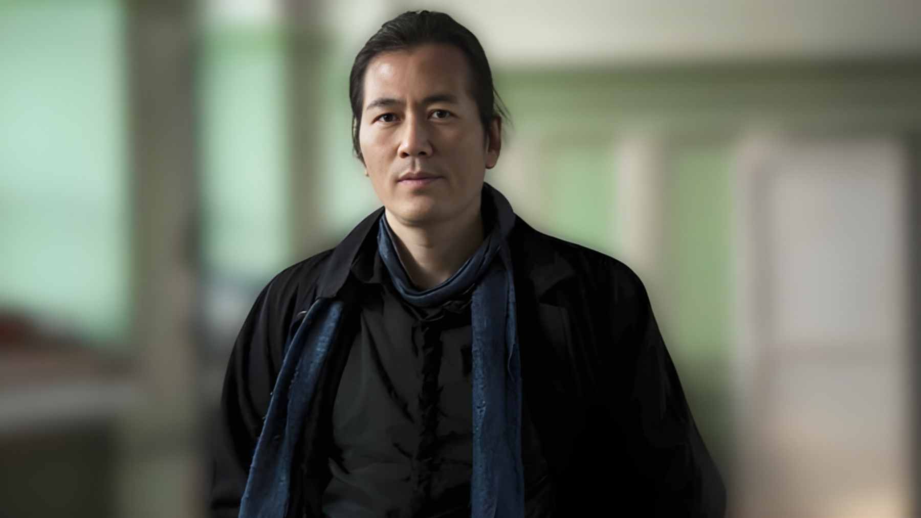 Philosopher Byung-Chul Han, winner of the 2025 Princess of Asturias Award, sitting in a minimalist, quiet home environment.