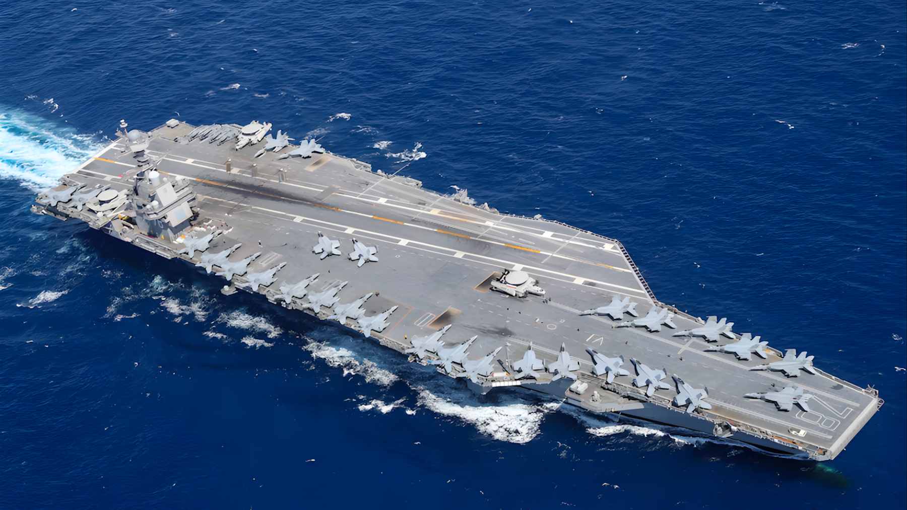 Aerial view of the USS Gerald R. Ford (CVN 78) nuclear-powered aircraft carrier at sea.